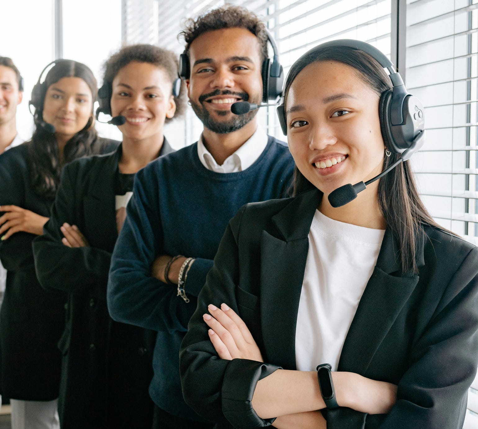 Happy Call Center Agents Looking at Camera